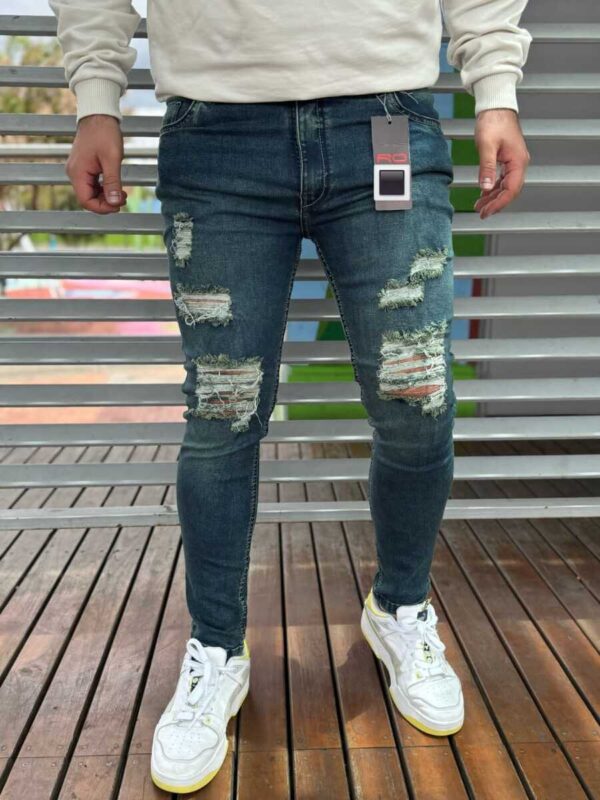 Jean con efecto envecido y rotos para hombre